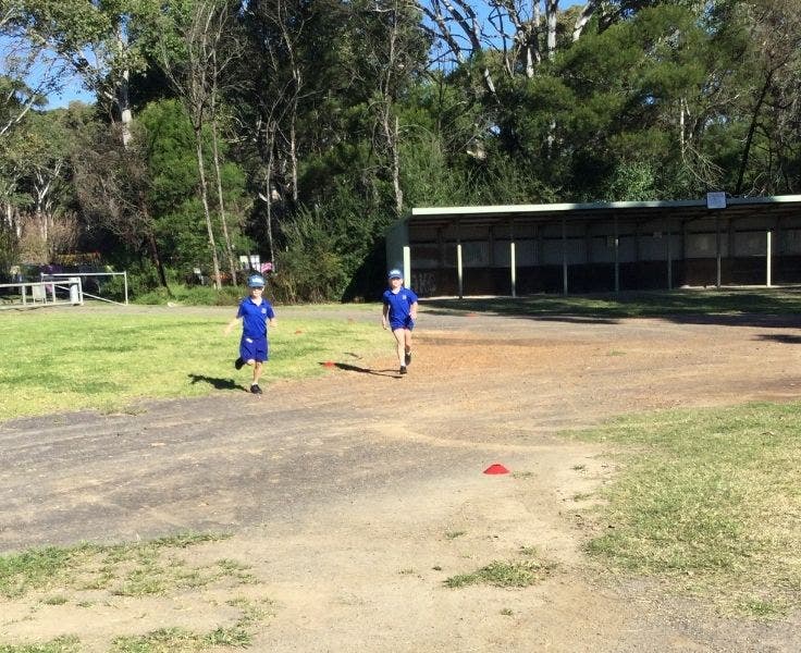 Teo students running at a sports field
